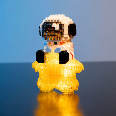 Tiny astronaut sitting on a glowing star — Lumari Minis by LumiBlocks